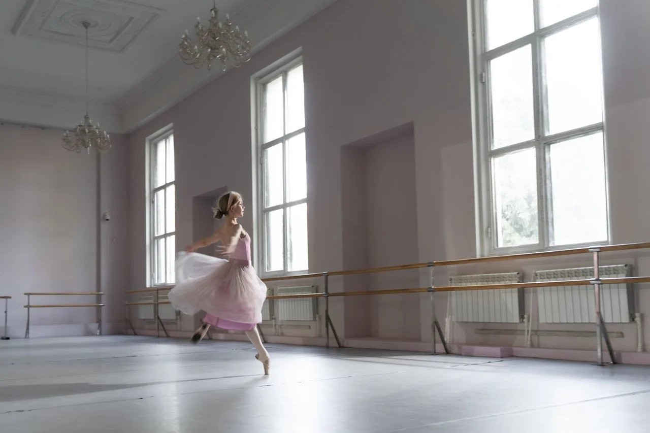 Sunlit rehearsal room where music and footsteps resonate softly